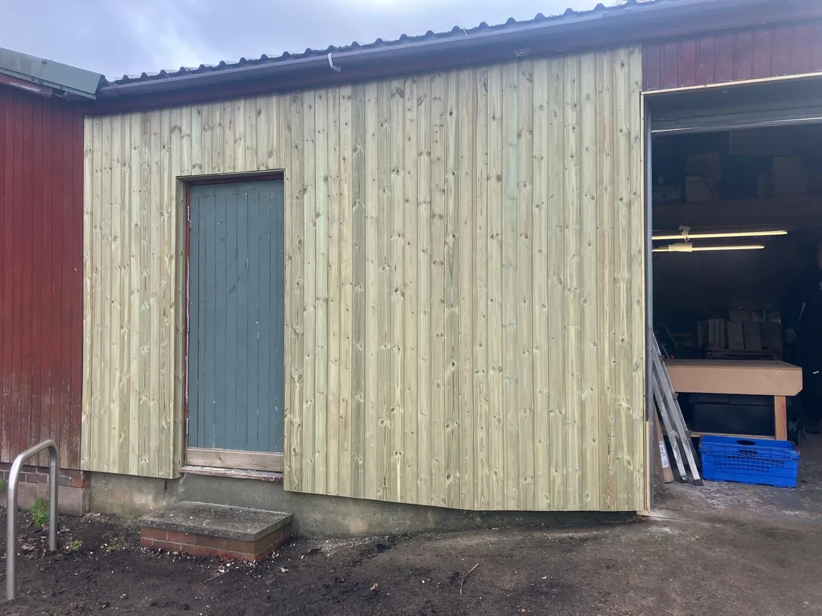 New timber cladding fitted to the side of an outbuilding